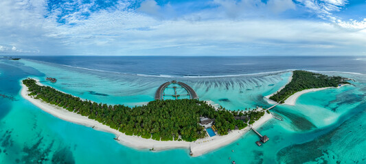Malè, Maldives - 23 December 2023: Panoramic aerial view of Niyama Private Island with luxury resort bungalows on Maldives archipelagos.