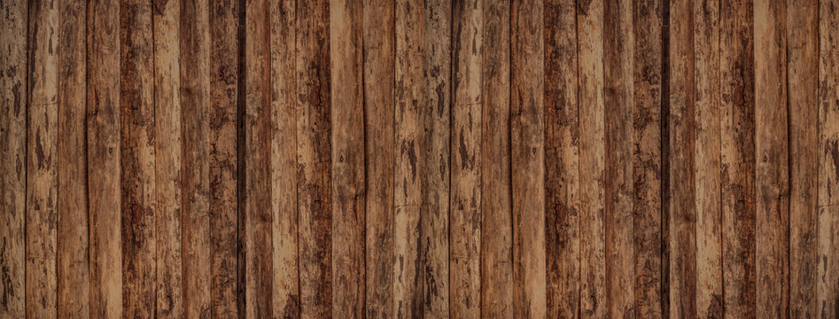 Wooden fence in vintage style. Abstract background. Destroyed surface in brown tones. 
