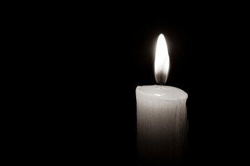 Fototapeta na wymiar concept of mourn, Candle dark on black background,RIP