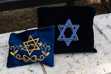 Tallit or Jewish prayer shawl carrying bag with the Hebrew word 