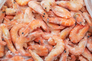 Frozen shrimp in fridge at the fish market. Healthy eating and fish market concept