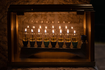 Oil candles burn on Hanukkah in Israel