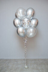 silver chrome balloons, steel color helium balloons on the floor