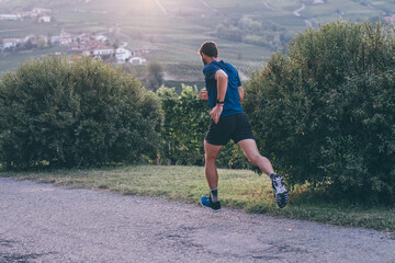 Man running in the countryside at the sunset