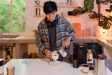 man using Italian moka coffee pot, barista pouring espresso coffee into cup with equipment, kettle...