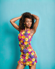 Portrait of beautiful afro hairstyle black woman wearing a dress of colorful flowers. Spring season fashion concept. Photorealistic generative ai image.