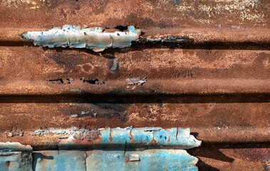 pattern rusty metal surface with remnants of blue paint