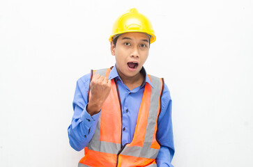 overjoyed asian male construction worker opening mouth shocked and surprised. construction worker with wow expression.