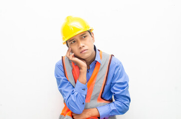 stressed over work concept illustrated by asian male construction worker in blue shirt, orange vest and yellow safety helmet with furious, mad, sad, angry expression. overworked concept