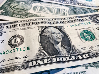 US dollar bills. One dollar. American money. Concept about the value of US dollars and inflation.