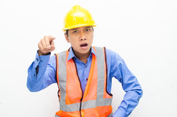 stressed over work concept illustrated by asian male construction worker in blue shirt, orange vest and yellow safety helmet with furious, mad, sad, angry expression. overworked concept