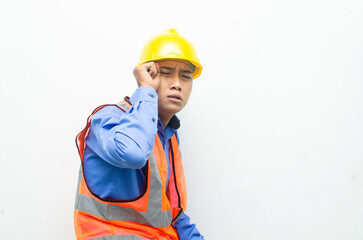thoughtful asian male construction worker in pensive mood doing thinking and wondering gesture.