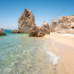 Empty beach with crystal clear sea water and phenomenal rocks. Greece, Halkidiki, Athos peninsula,...