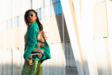 Urban woman enjoy outside. Modern woman posing with roller skates