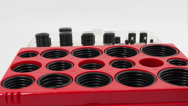 Rubber gaskets for plumbing. Hydraulic and pneumatic o-rings in black in different sizes on a white background.