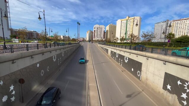 Cars driving onto an underground tunnel in Tanger, Morocco