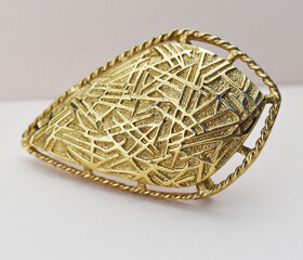 Old vintage brooch on beige background, accent retro jewelry for women
