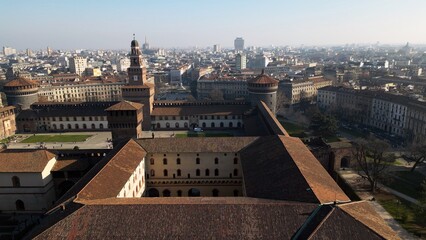 Obraz premium EUROPE, ITALY MILAN 2023 - Drone aerial view from Sforza Castle in Sempione park with skyline of the city in downtown - Via Dante and Duomo cathedral 