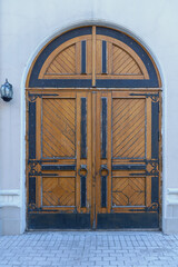 old wooden door with metal decorations in the historical part of the Croatian city of Dubrovnik