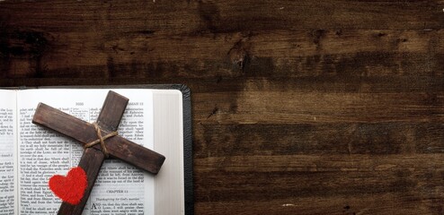 Holy Bible book on the wooden table with Cross