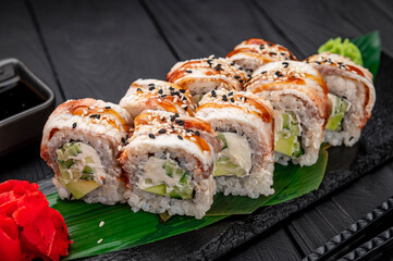 Sushi rolls japanese food on a dark background. Roll with eel