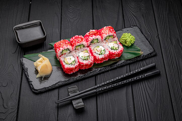 California sushi roll with crab, avocado, cucumber and tobiko caviar served