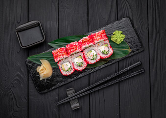 California sushi roll with crab, avocado, cucumber and tobiko caviar served