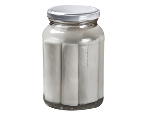 Glass jars with heart of palm on white