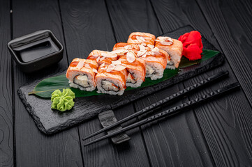 Sushi rolls with grilled salmon and pear.