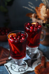 Two glasses with cranberry drink in autumn rustic style