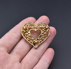 Vintage brooch on black background, old accent retro jewelry for women