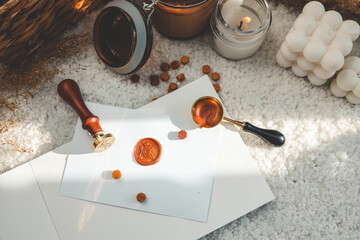 Wax printing tools on the background of candles
