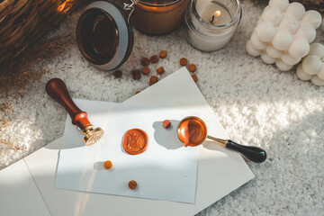 Wax printing tools on the background of candles