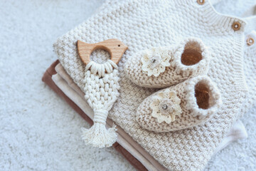 Fototapeta na wymiar Set of knitted things for a newborn handmade