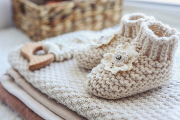 Knitted socks and a toy for a newborn handmade close-up
