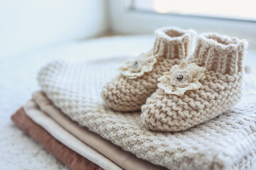 Fototapeta na wymiar Handmade knitted socks for a newborn close-up