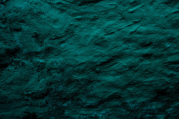 Teal colored abstract wall background with textures of different shades of teal