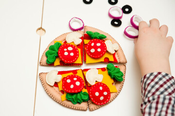 Felt pizza. Felt food toys for the kids. Preschool game for young children. Montessori education
