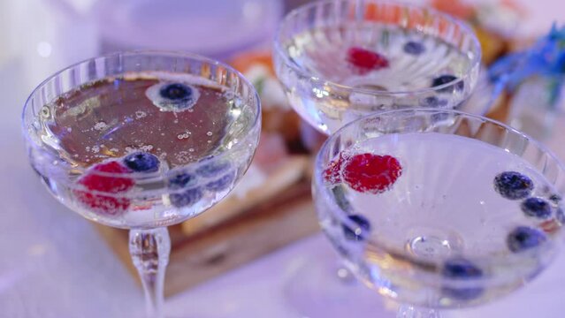 Alcoholic beverages with berries. Cocktail glasses at the event close-up
