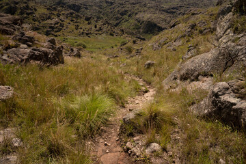 View of the empty hiking path across the hills and meadow. 