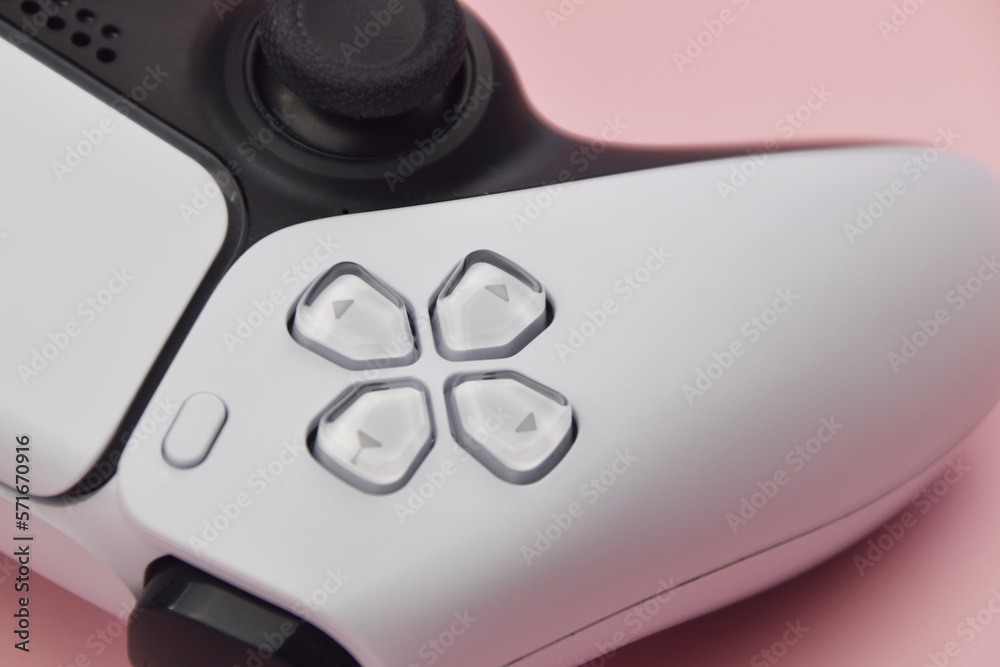 Wall mural White game controllers on pink background