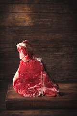 Florentine steak of beef (Bistecca alla Florentina) or Dry-aged raw T-bone or porterhouse beef...
