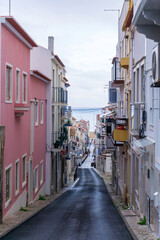 An empty old street leading to the ocean, in the historic center of the Nazare