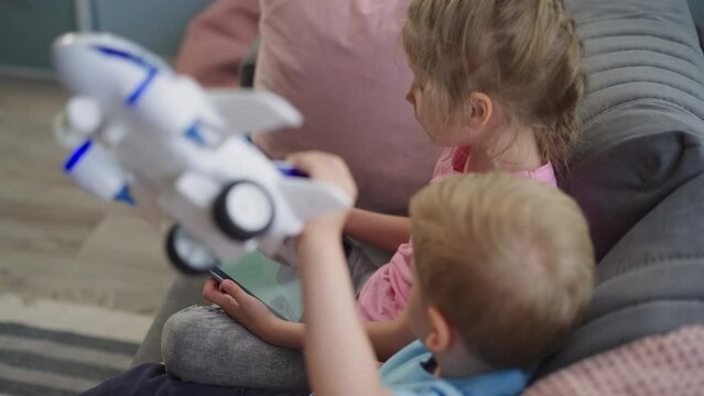 Preschooler And Toddler Talk With Grandma On Video Call