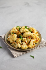 Homemade Roasted White Cauliflower on a Plate, side view.