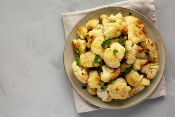 Homemade Roasted White Cauliflower on a Plate, top view. Flat lay, overhead, from above. Copy space.