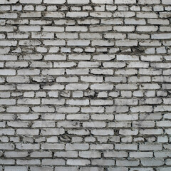 Grayscale backdrop with old realistic white brick wall. Minimal fragment of brickwall close-up. Minimalist monochrome background with wall of gray bricks in different shades. Simple wall texture.