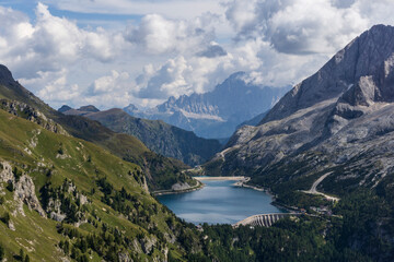 Naklejka na ściany i meble Great view of the Dolomites. Lago Fedaia and Marmolada.