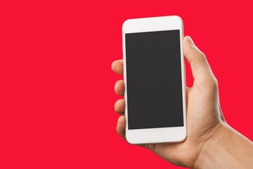 Hand hold modern smartphone with a blank screen