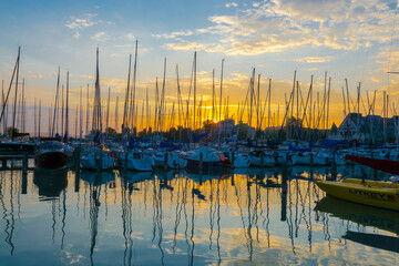 Sailing ships in the harbour of Balatonkenese at sunset